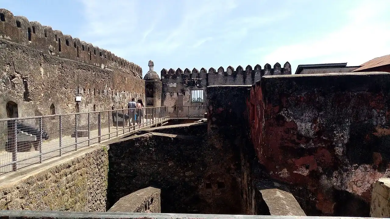 Stone ramparts, a walkway and an interior courtyard at Fort Jesus in Mombasa.