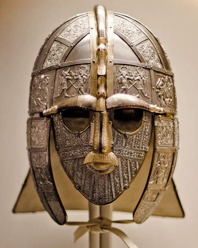 Modern replica of the Sutton Hoo helmet, showing its decorated face mask and metalwork.